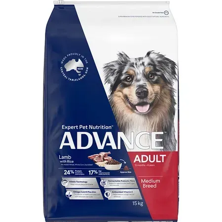 A bag of Advance Adult dog food with a photo of a medium-sized dog, mostly blue and white with brown markings, and the product name and details.