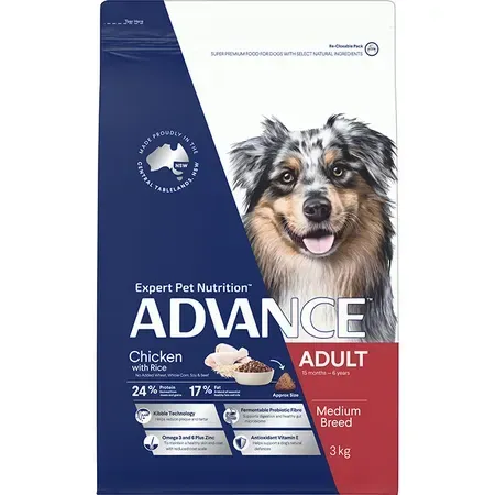 Blue bag of Advance adult dog food, featuring a photo of a happy, multi-colored Australian Shepherd dog.