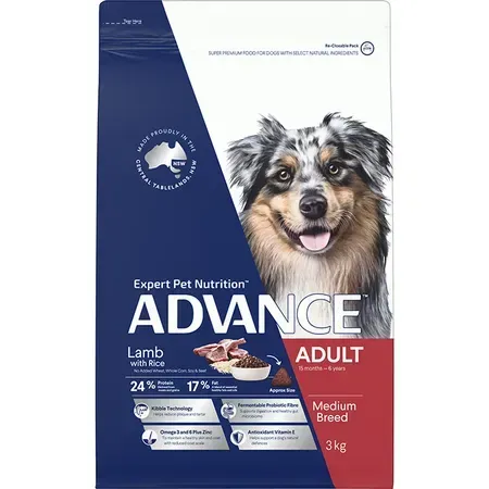Bag of Advance dog food; features a smiling Australian Shepherd, text indicating lamb and rice flavor for adult medium breed dogs.