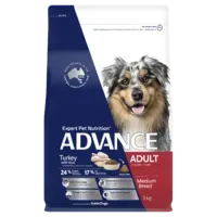 A bag of Advance Adult dog food, featuring a photo of an Australian Shepherd. The packaging is blue, white, and red.