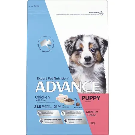 Bag of Advance puppy food with a photo of a cute medium-breed puppy on the front. It is blue and pink.