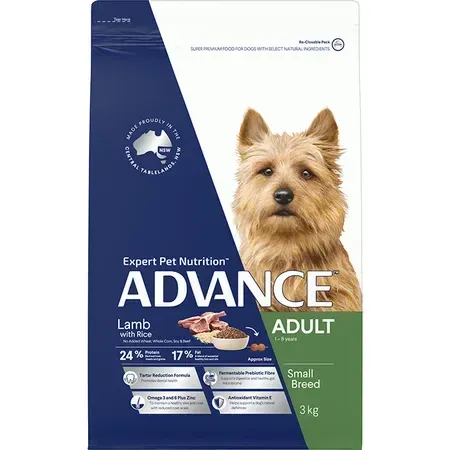 Bag of Advance dog food for small breed adults, featuring a dog's portrait. The bag is blue, white, and green with the text "Lamb with Rice."
