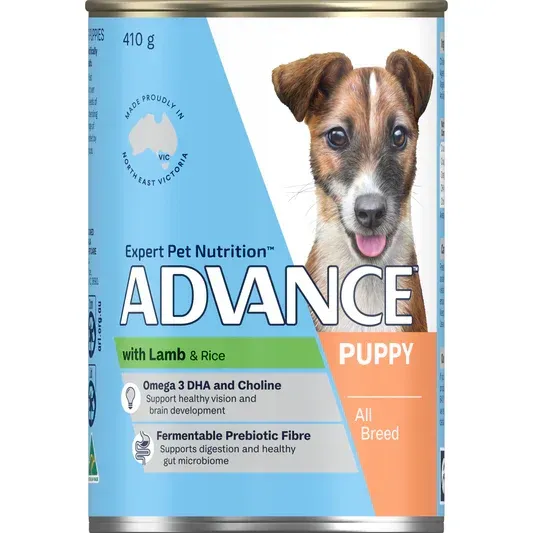 Canned dog food labeled "ADVANCE Puppy" with lamb and rice. Features a puppy and nutritional information.