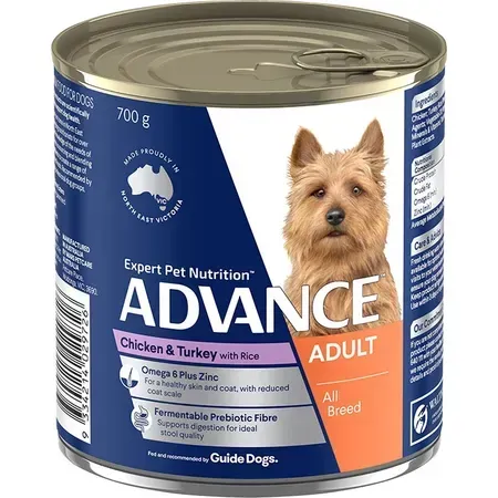 A can of Advance adult dog food. It features a photo of a tan dog on the label, with text indicating chicken and turkey with rice.