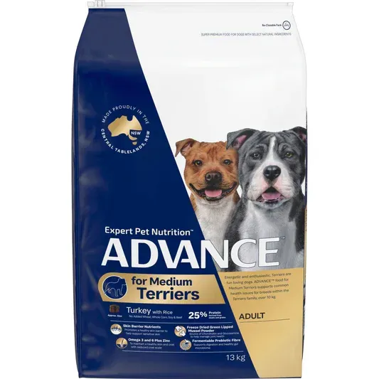 Bag of Advance dog food for adult medium terriers. Features two dogs, blue and white packaging.