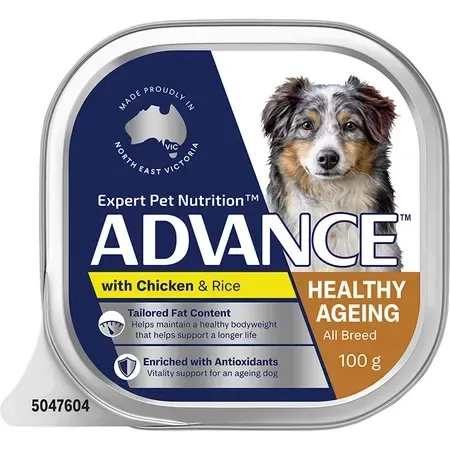 Dog food container labeled "Advance" with chicken and rice, for healthy aging, with a photo of a dog.