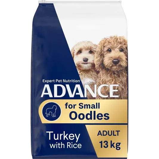 Dog food bag labeled "Advance for Small Oodles" with two small poodle-mix dogs, turkey with rice flavor, and 13 kg size.