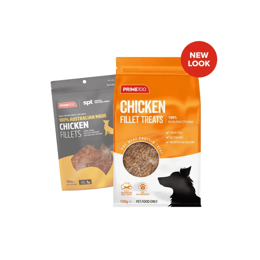 Two packages of dog treats, one gray and one orange, with the "Prime 100" brand name. The orange package has a "New Look" sticker.