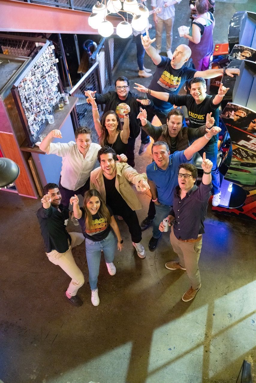 A group of people are posing for a picture in a room.