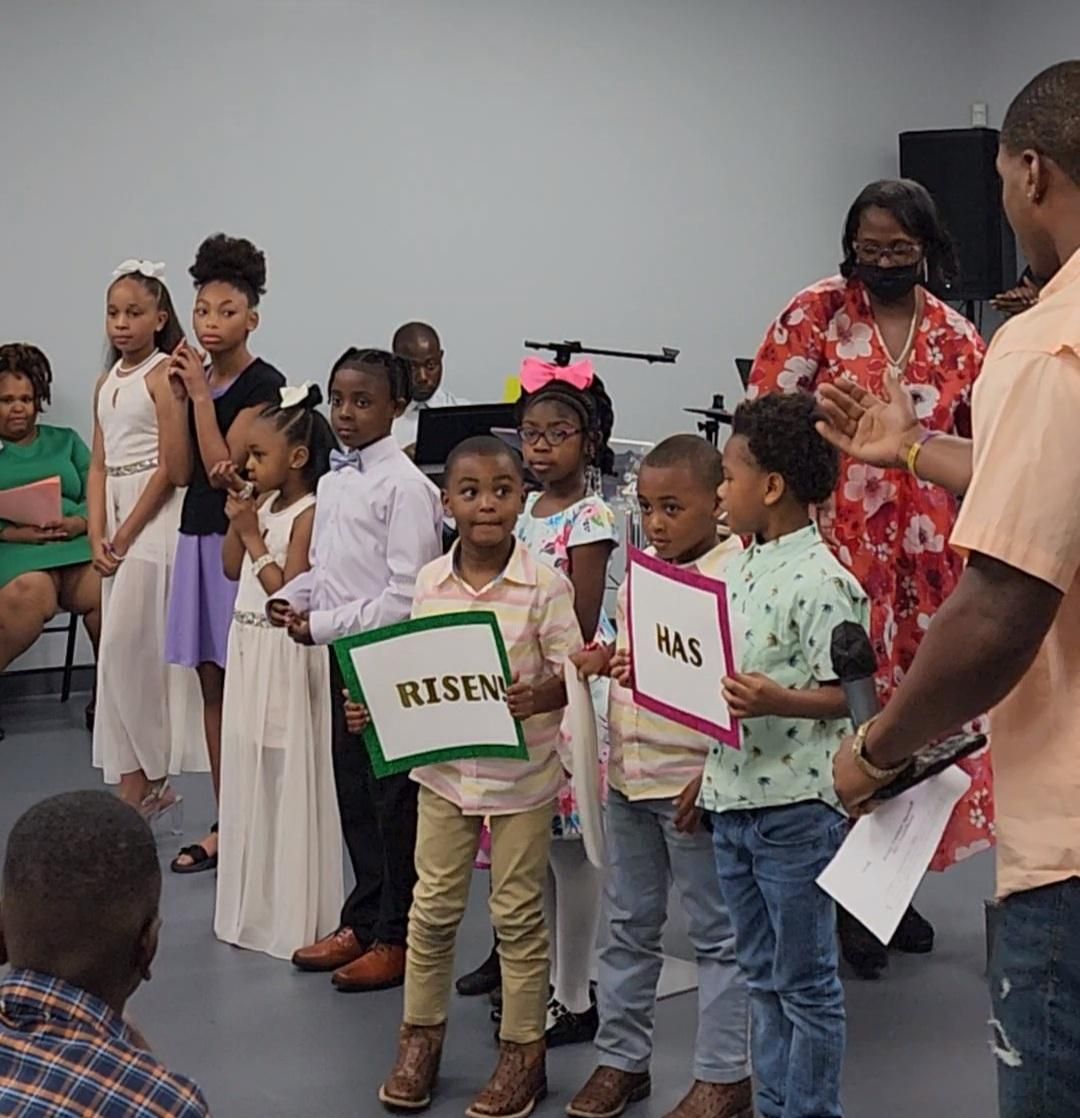 Children holding signs saying 