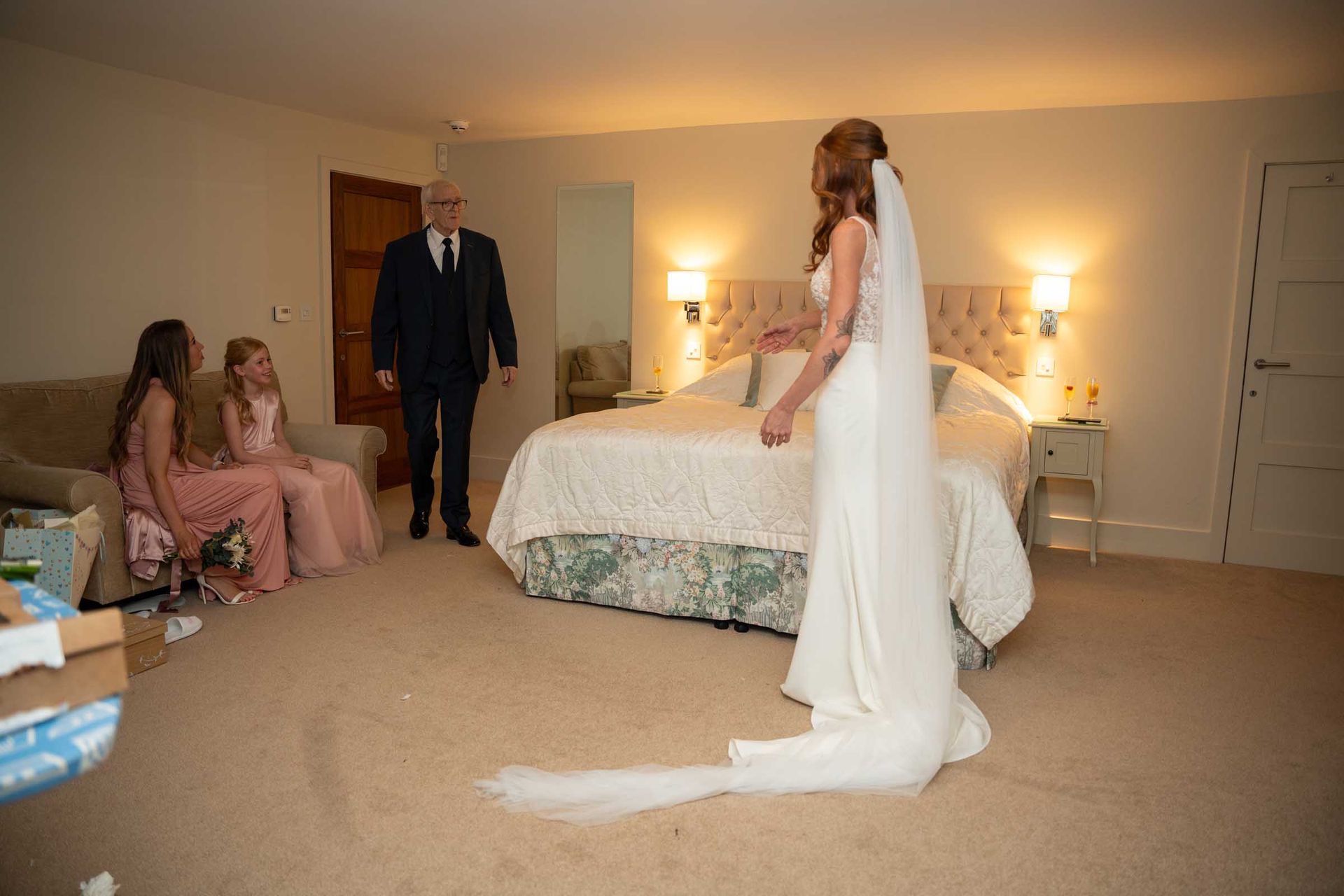A bride is getting ready for her wedding in a hotel room.