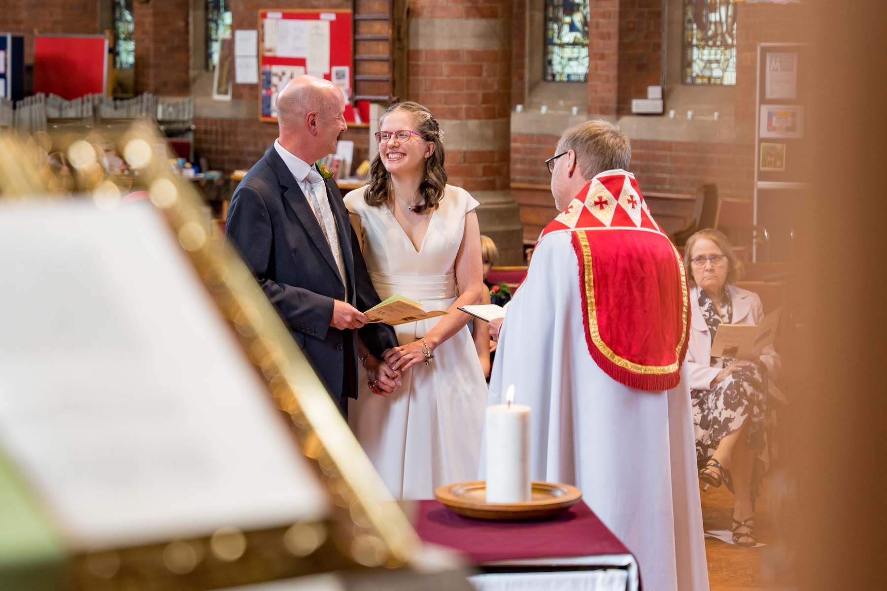 A bride and groom are getting married in a church.