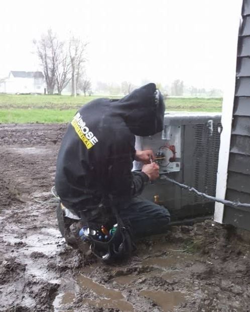 A man wearing a hoodie with the word moose on it