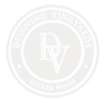 A white logo for dunning vineyards estate wines.