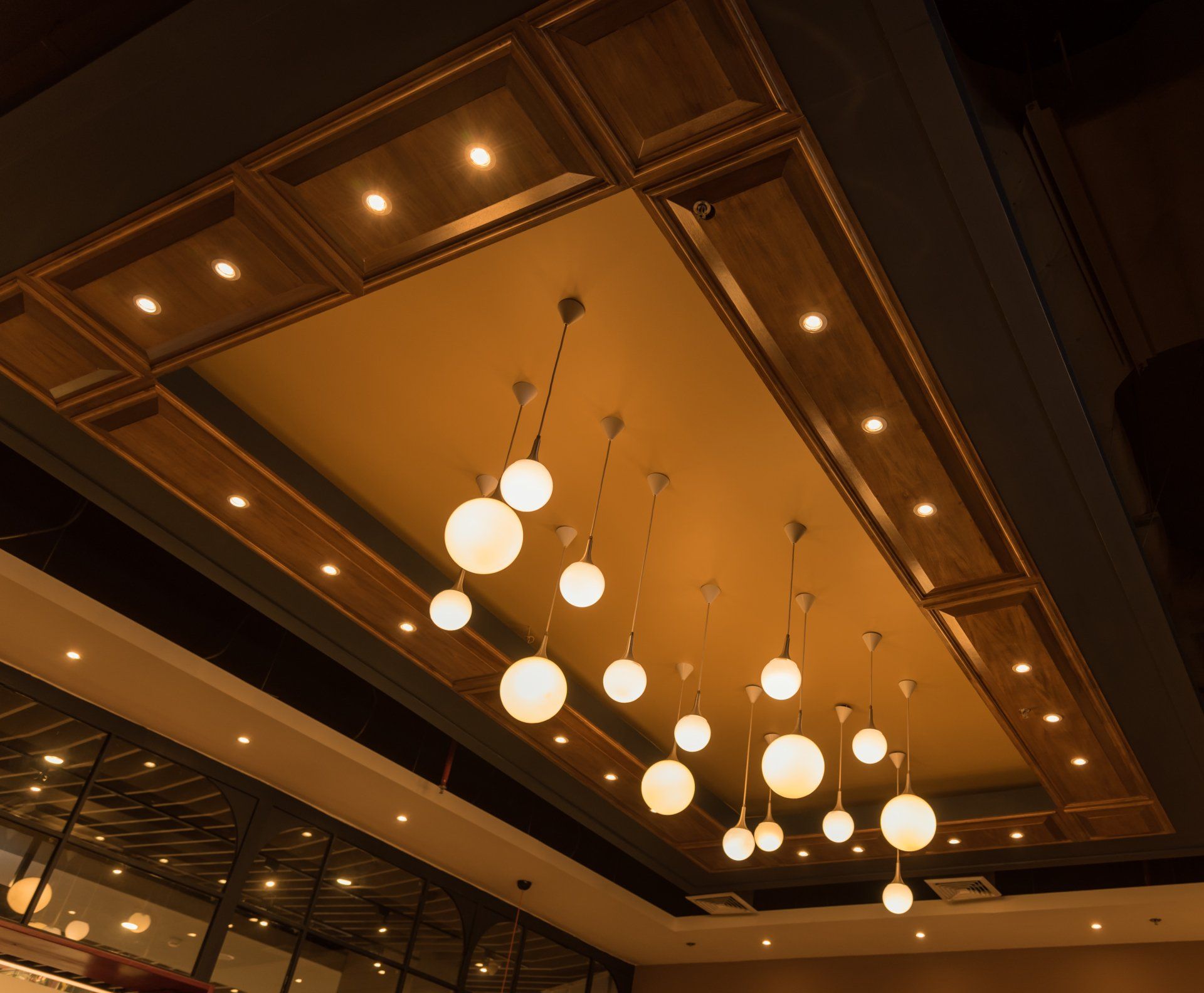 A ceiling with a lot of lights hanging from it