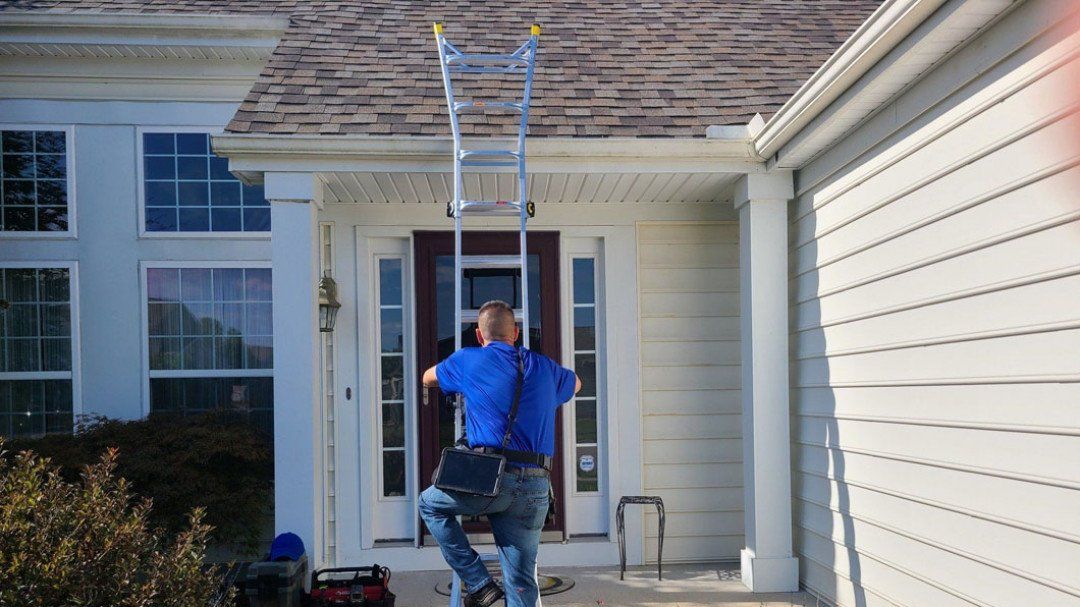 Man Using a Ladder