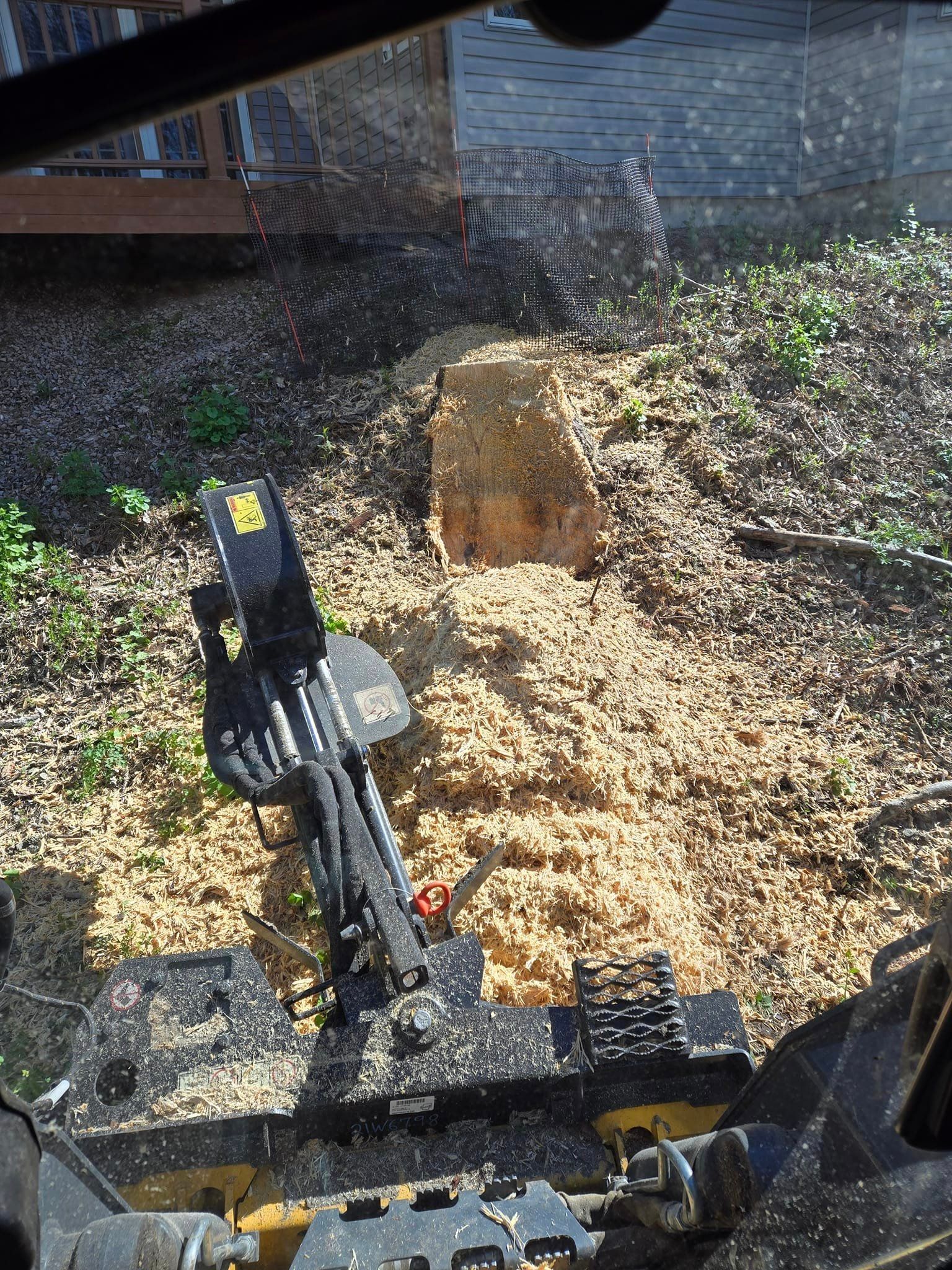 machine grinding a stump in Wausau, WI