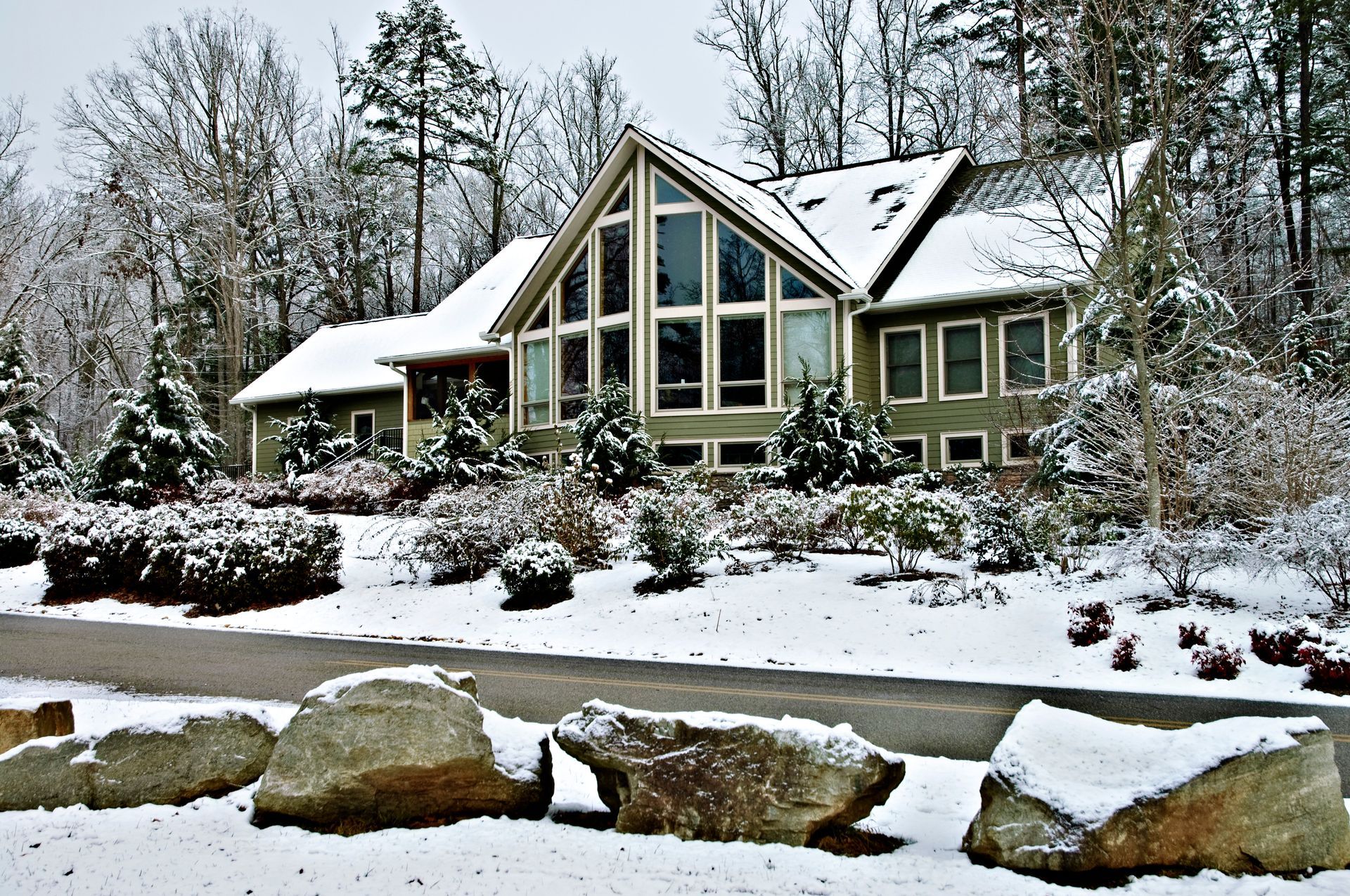 snowy yard in front of home