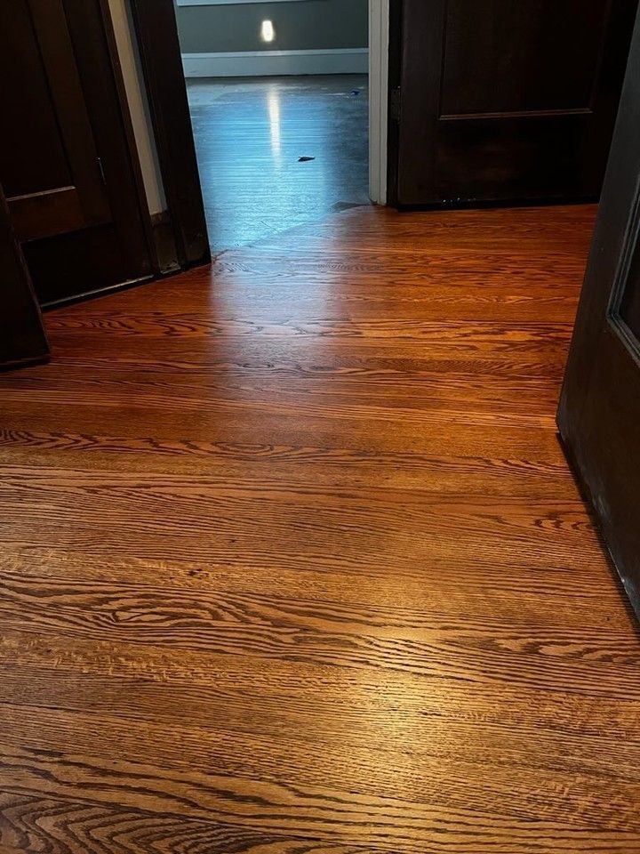 A close up of a wooden floor in a room