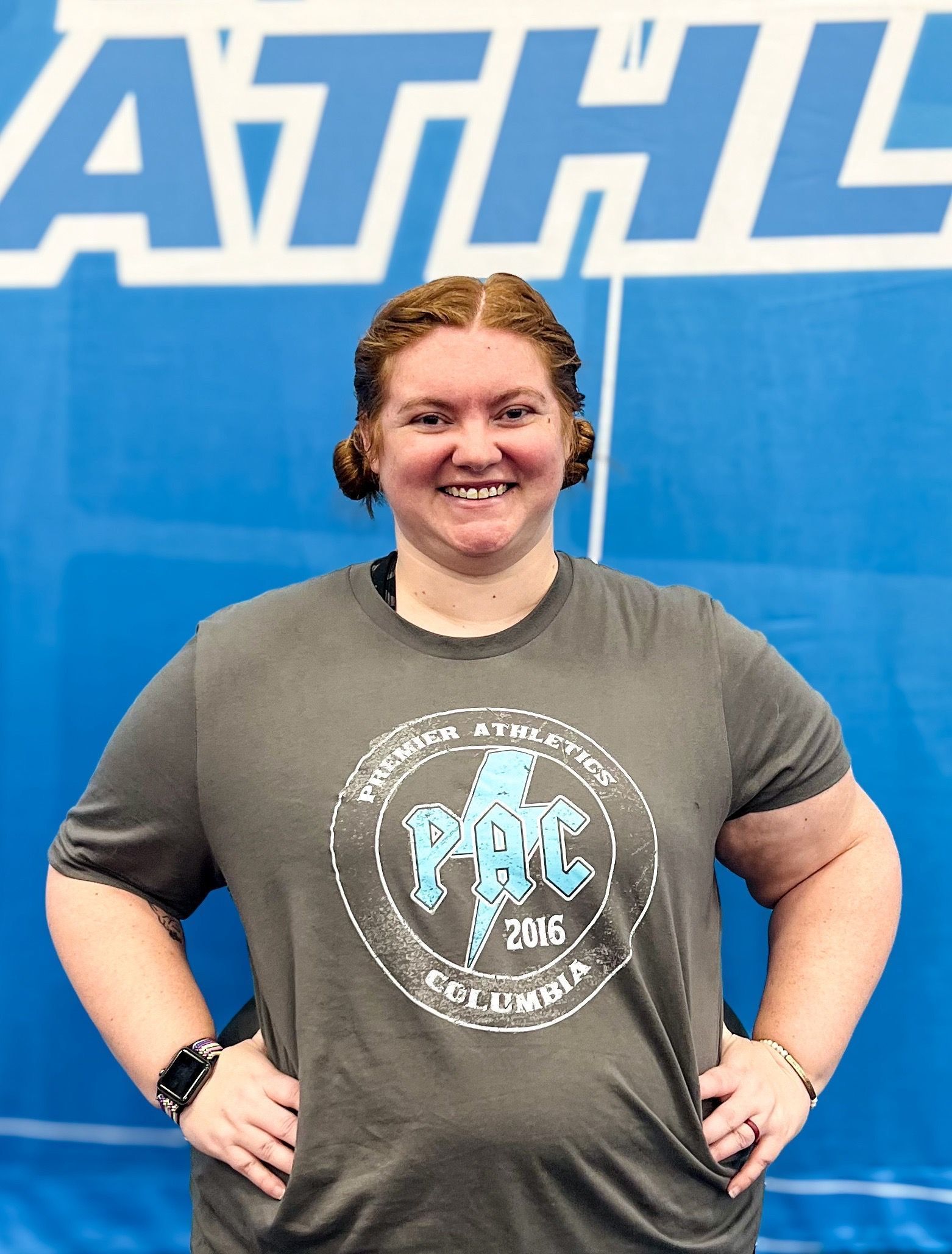 A woman wearing a t-shirt with the year 2016 on it