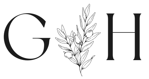 A black and white drawing of a letter g and h with leaves.