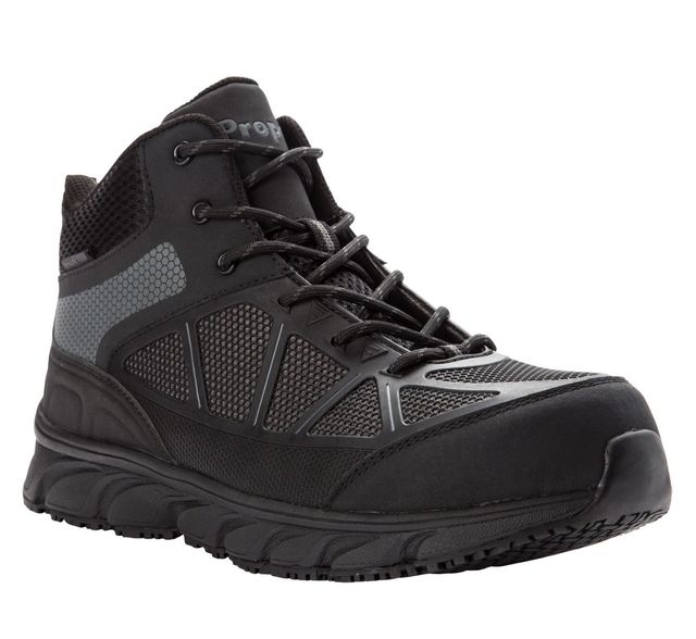 A pair of black safety shoes with a rubber sole on a white background.