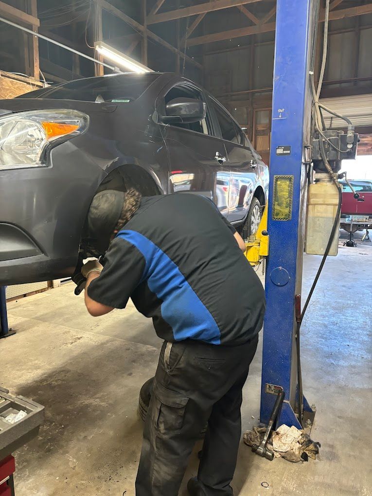 Mechanic working on tire | Hansen Auto Repair