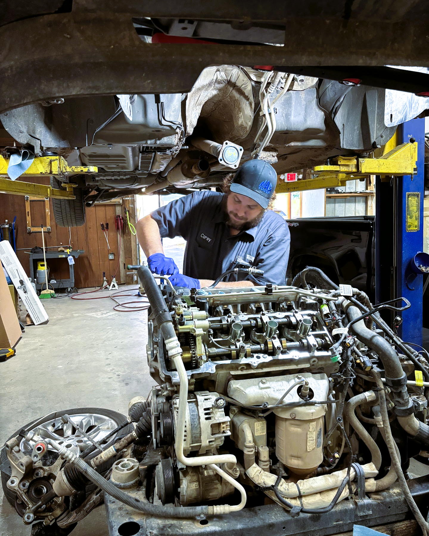 Mechanic working on engine | Hansen Auto Repair