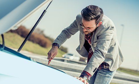 Performing an oil change on a car - Auto Rescue in  St. Salinas, CA