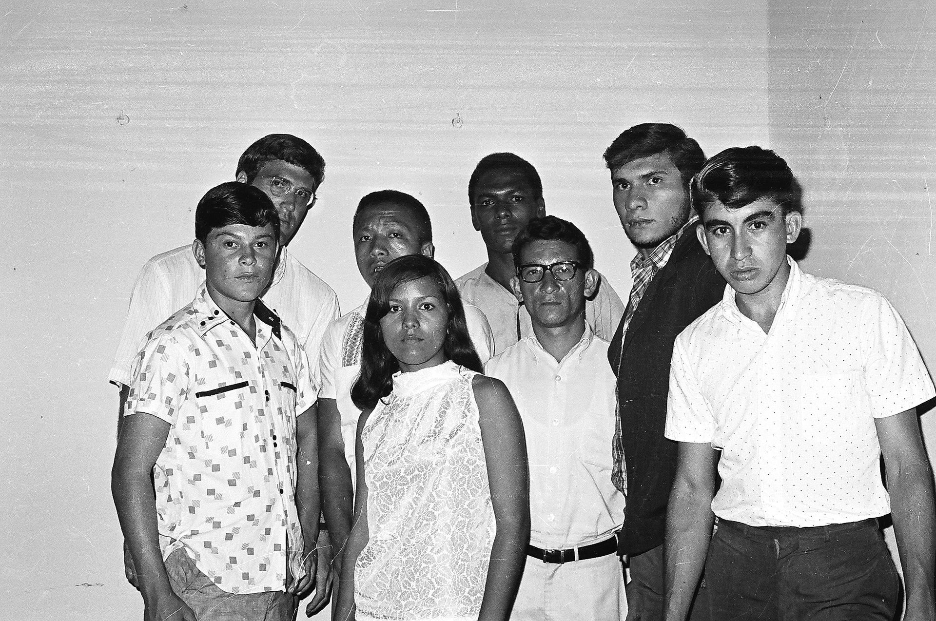 A black and white photo of a group of young people
