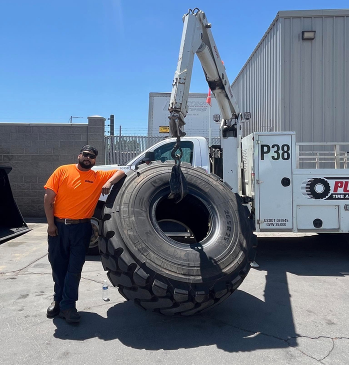Mobile mechanic Hector with heavy-duty tire repair equipment in Salt Lake City