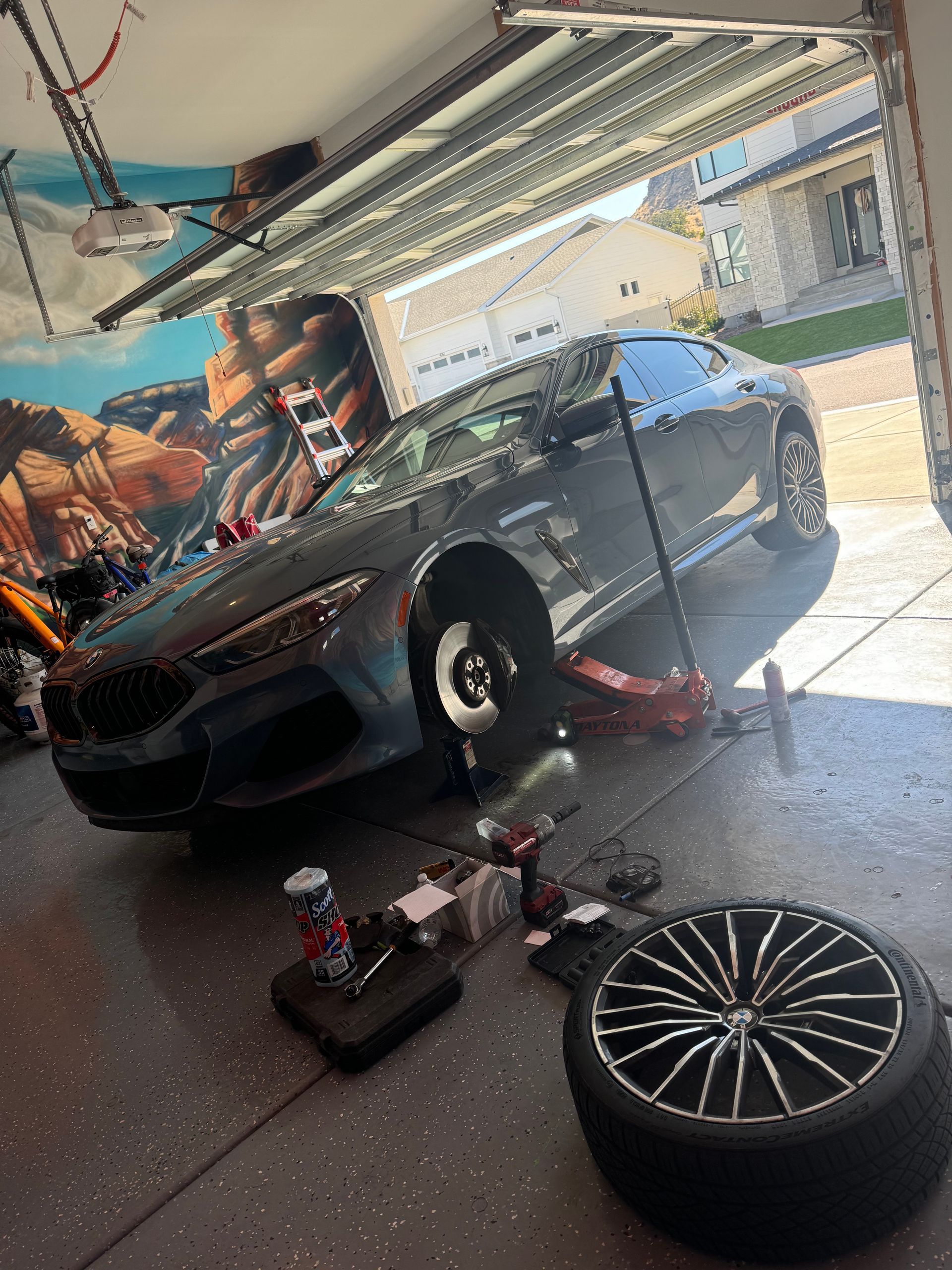 Luxury car brake and rotor repair at customer garage in Salt Lake City