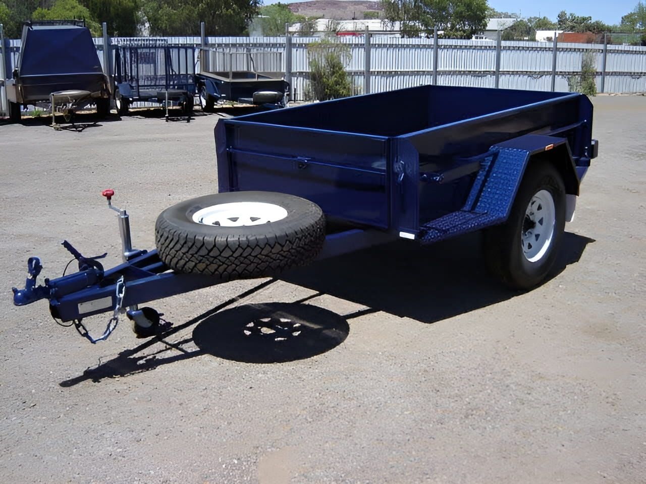 A Blue Trailer With A Spare Tire Attached To It — Centre Trailer Hire and Parts In Ciccone, NT