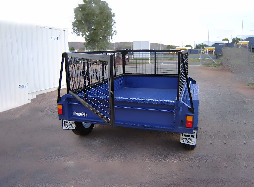 A blue trailer is parked in a parking lot — Centre Trailer Hire and Parts In Ciccone, NT