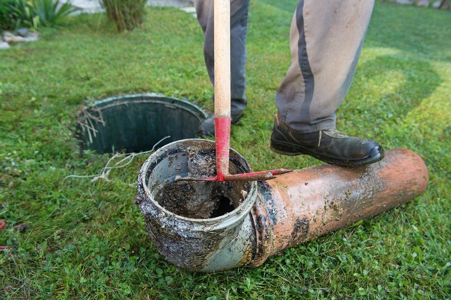 man stepping in the septic pipe