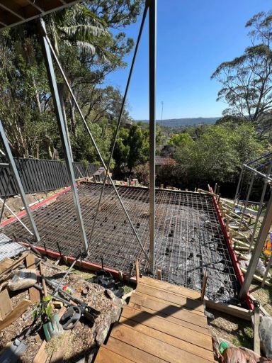 A Concrete Slab is Being Built on Top of a Wooden Deck — Coastal Kerb and Concrete In Buff Point, NSW