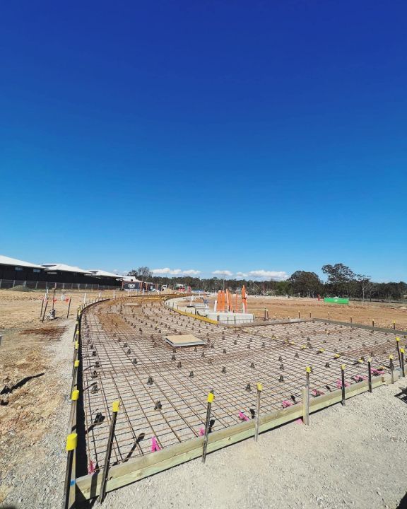 A Construction Site With a Lot of Concrete and a Blue Sky in the Background — Coastal Kerb and Concrete In Buff Point, NSW
