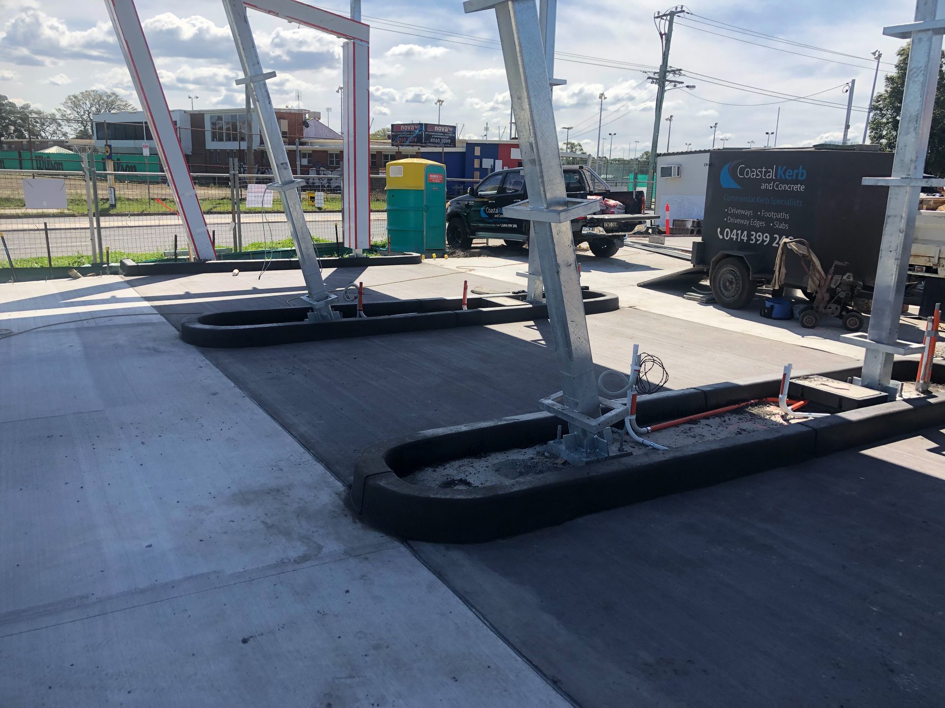 A Yellow Stripe Speed Ramp on Concrete Road — Contact Our Concreters in Wyong NSW