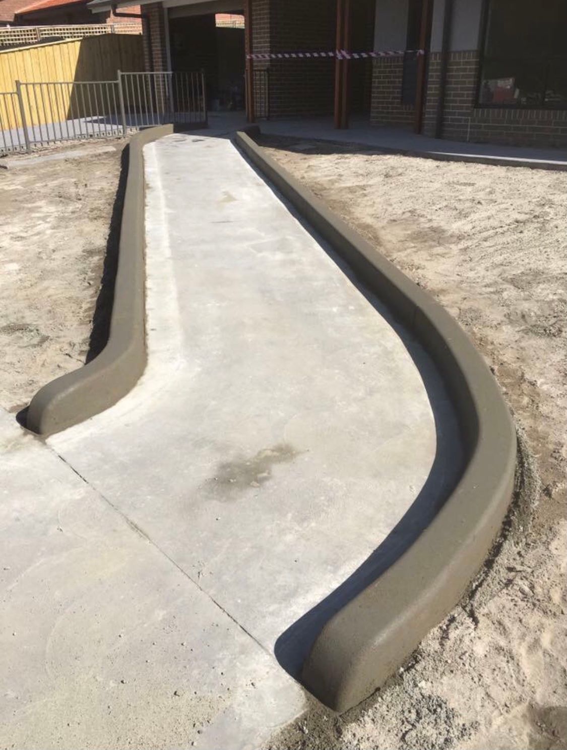 Concrete Kerbs On Narrow Pathway — Contact Our Concreters in Woy Woy, NSW