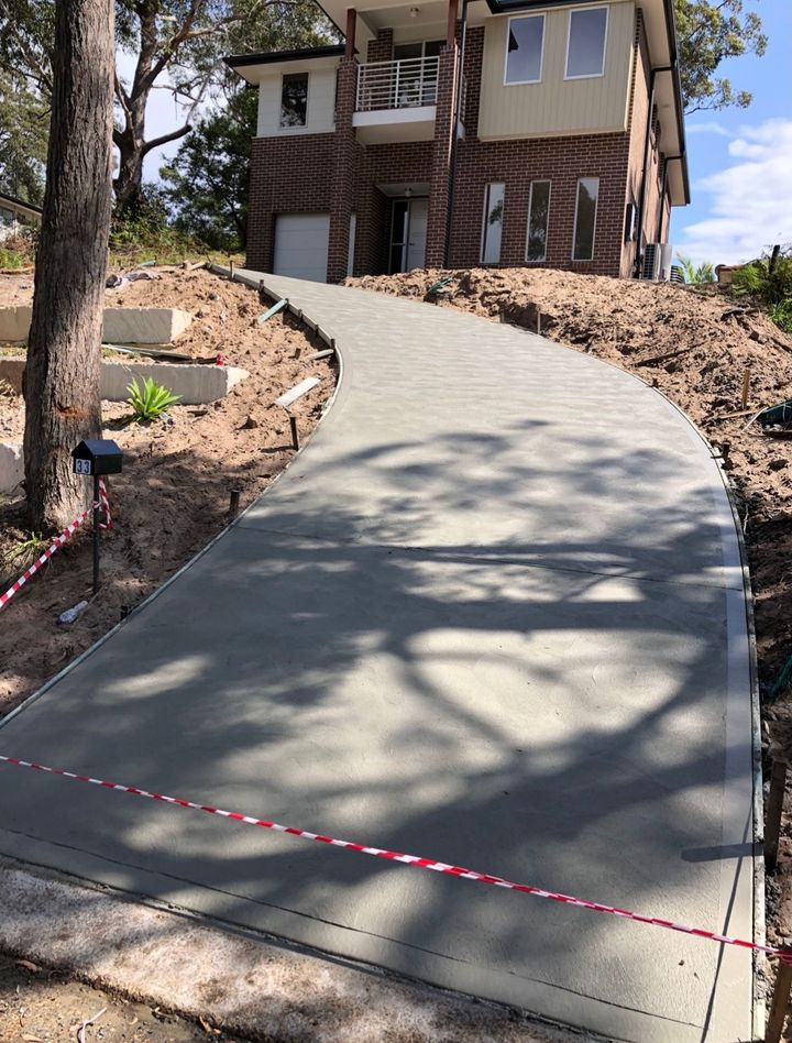 Concrete Driveway Leading To House On Hill— Concreters on the Central Coast, NSW