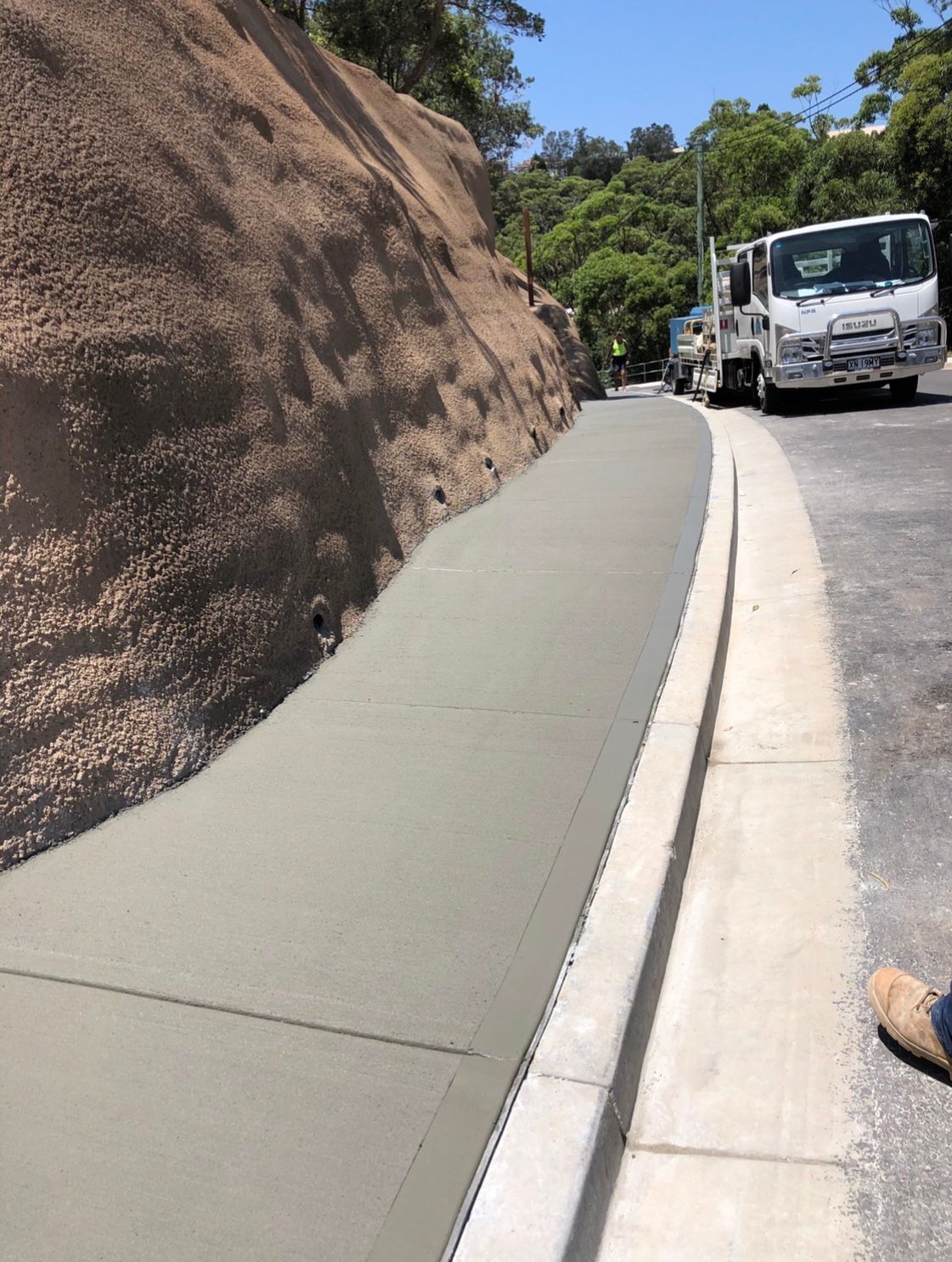 Concrete Driveway Leading to a Side Entry Garage — Contact Our Concreters in Wyong NSW