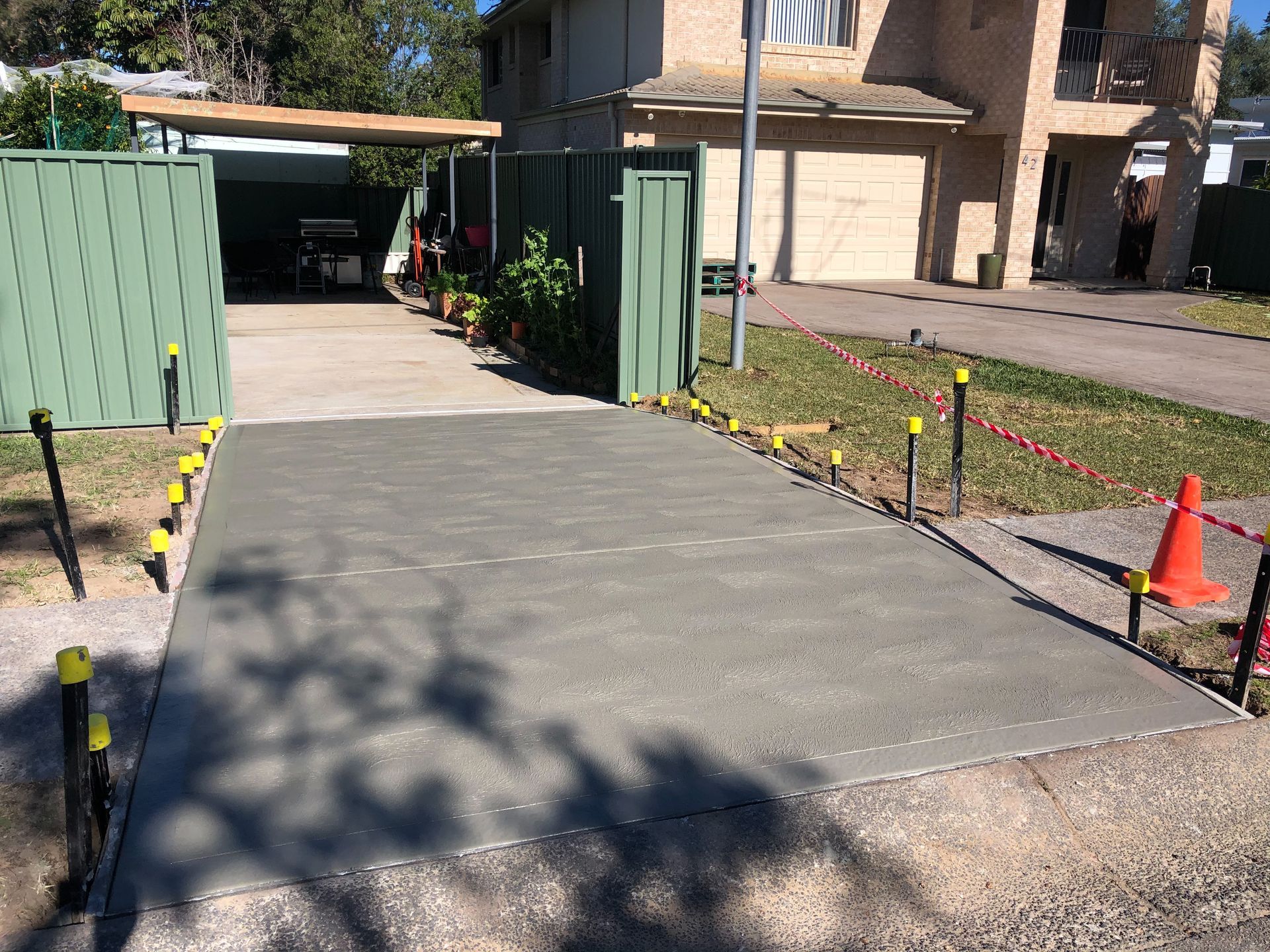 Wide Concrete Driveway — Contact Our Concreters in Woy Woy, NSW