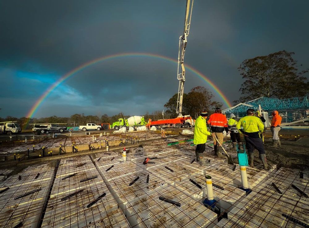 Group of Workers Laying out Concrete