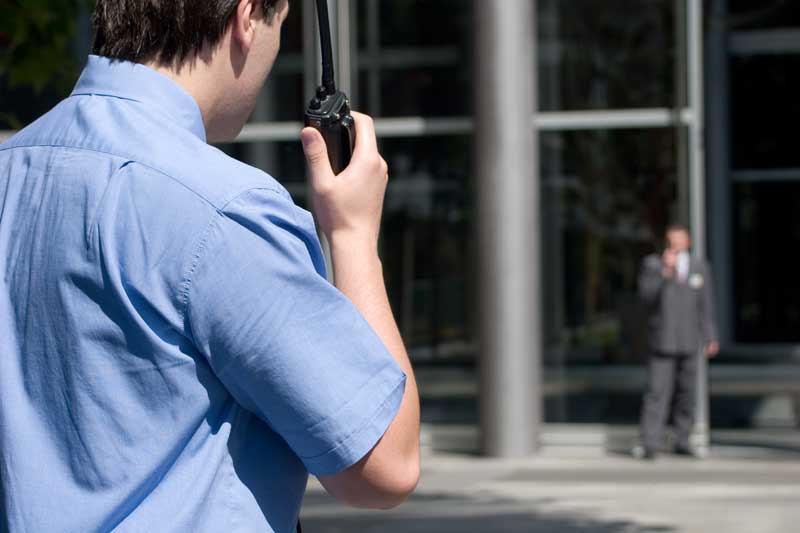 Security Guard Listening to His Earpiece — Darwin, NT — Eyesight Security