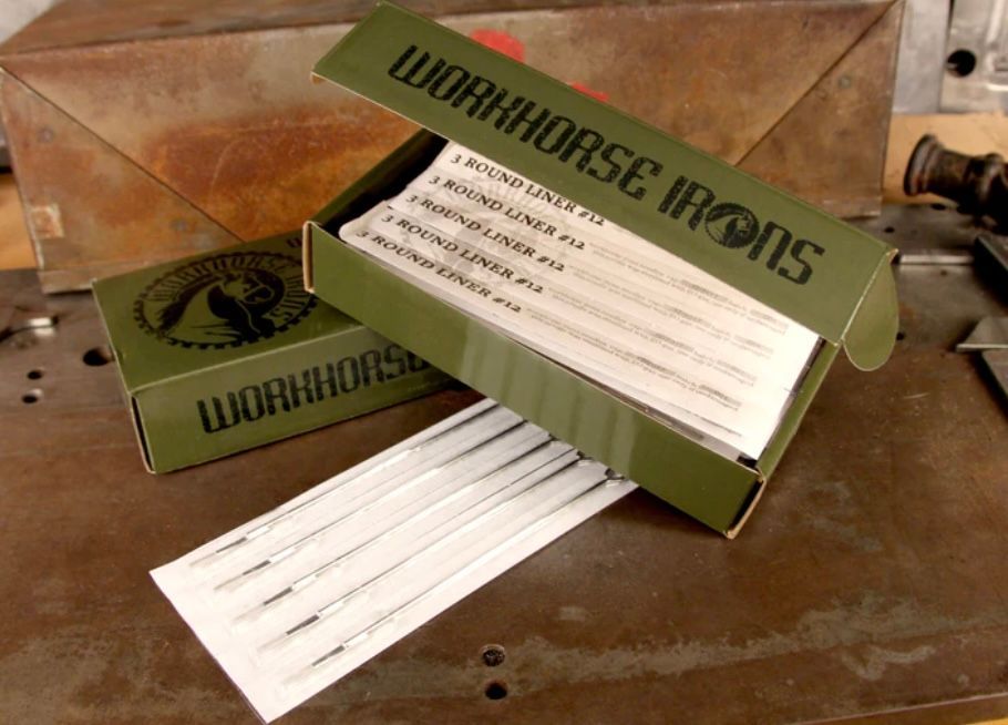 A box of workhorse irons sits on a table