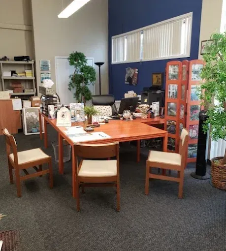 A room with a table and chairs in it