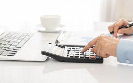 Man using a calculator — Audits in Timonium, MD