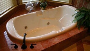 Porcelain Modern Bathtub — Plumbing Repairs in Saint Ann, MO