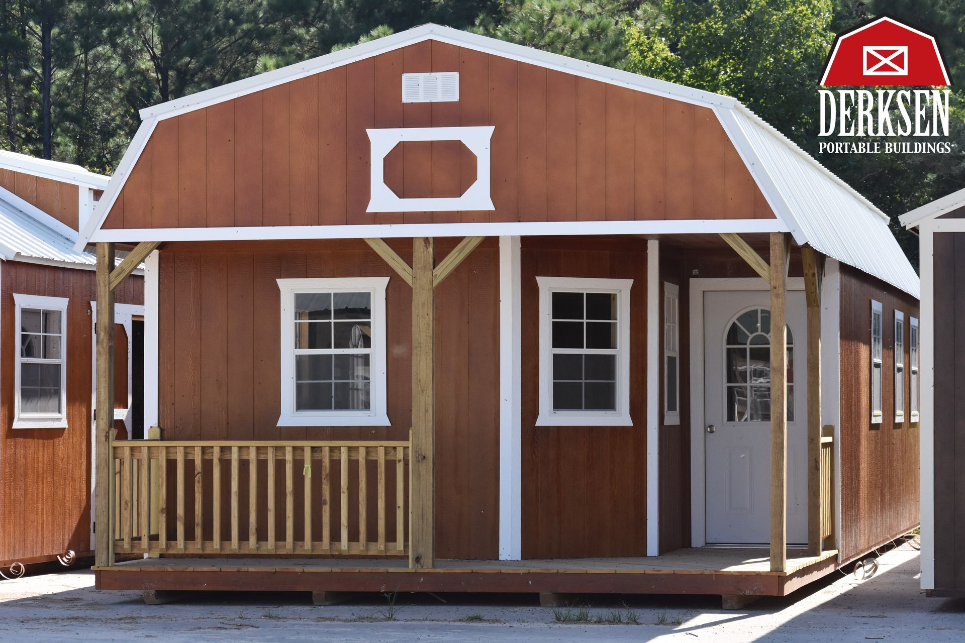 A small house with a porch and a sign that says derksen