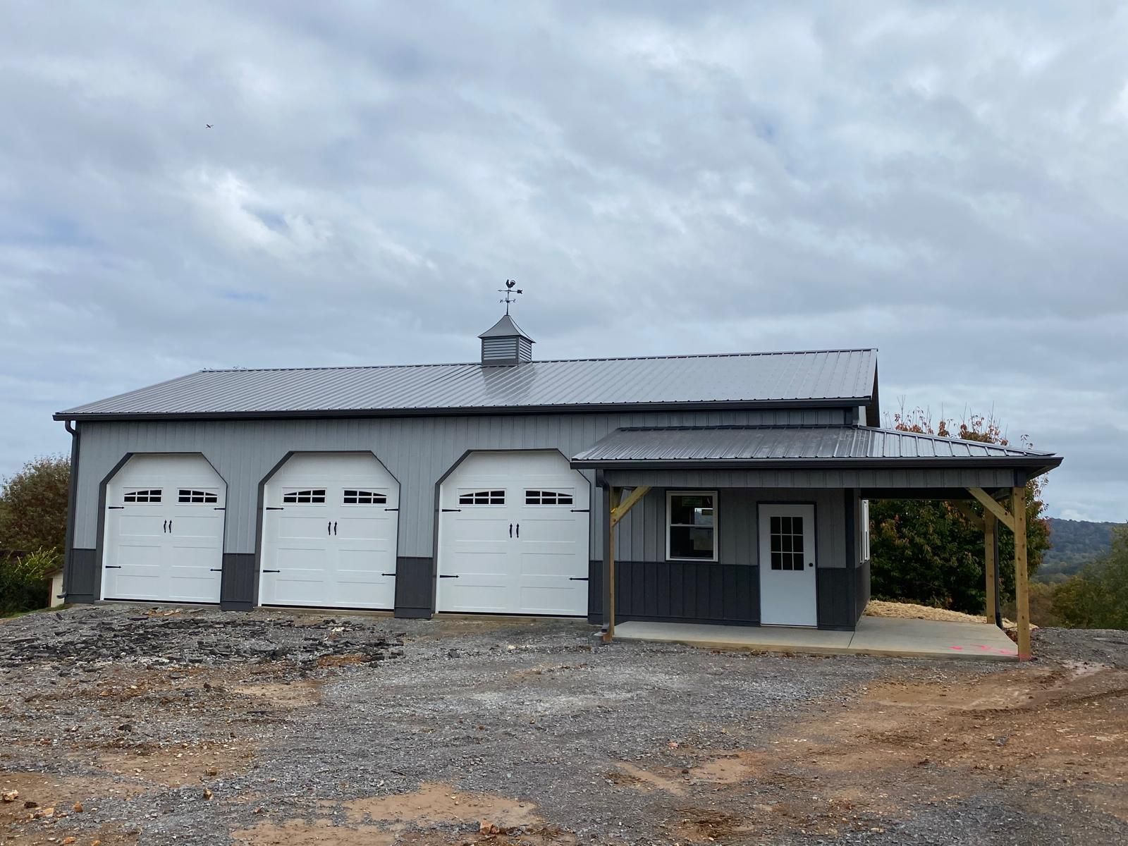 A red barn with white trim and a white roof